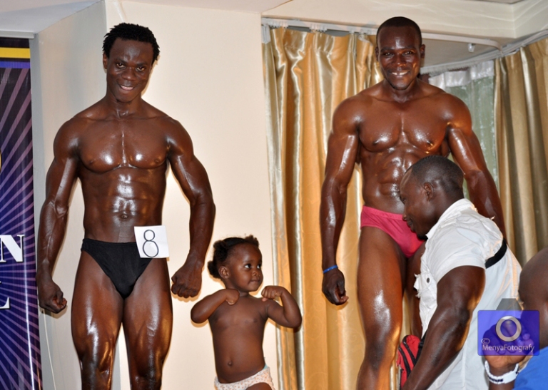 Former Mr. Kampala Ivan Byekwaso (in white) is dared by his daughter at the event